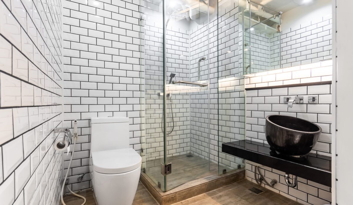 Clean and white bathroom with amenities in apartment.